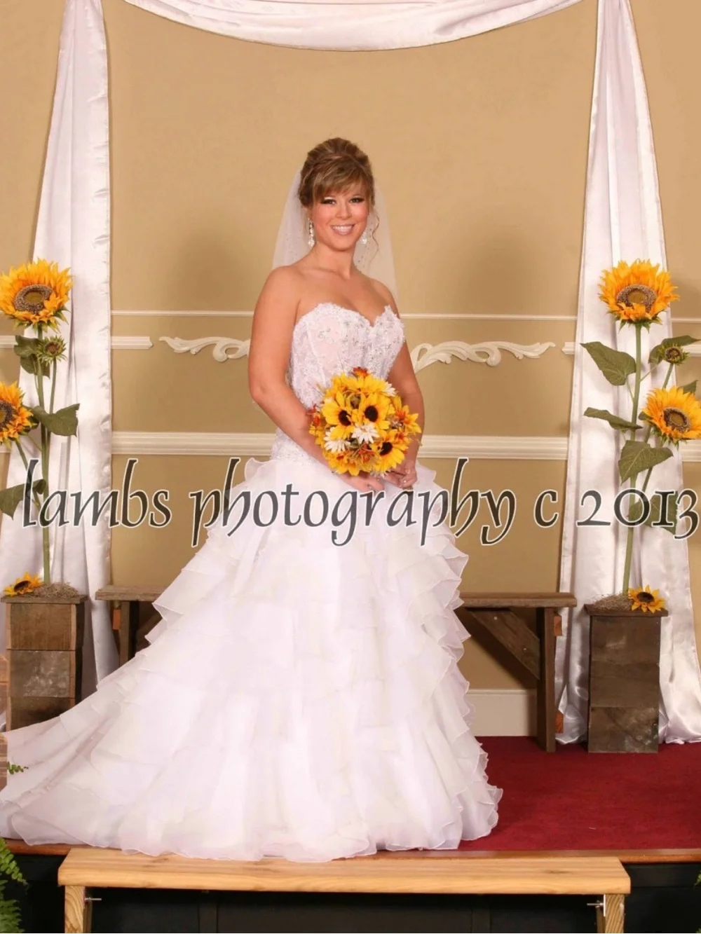 Oleg Cassini White Strapless Bridal Portrait with Sunflower Bouquet